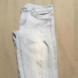 American Eagle light blue slightly ripped jeans.